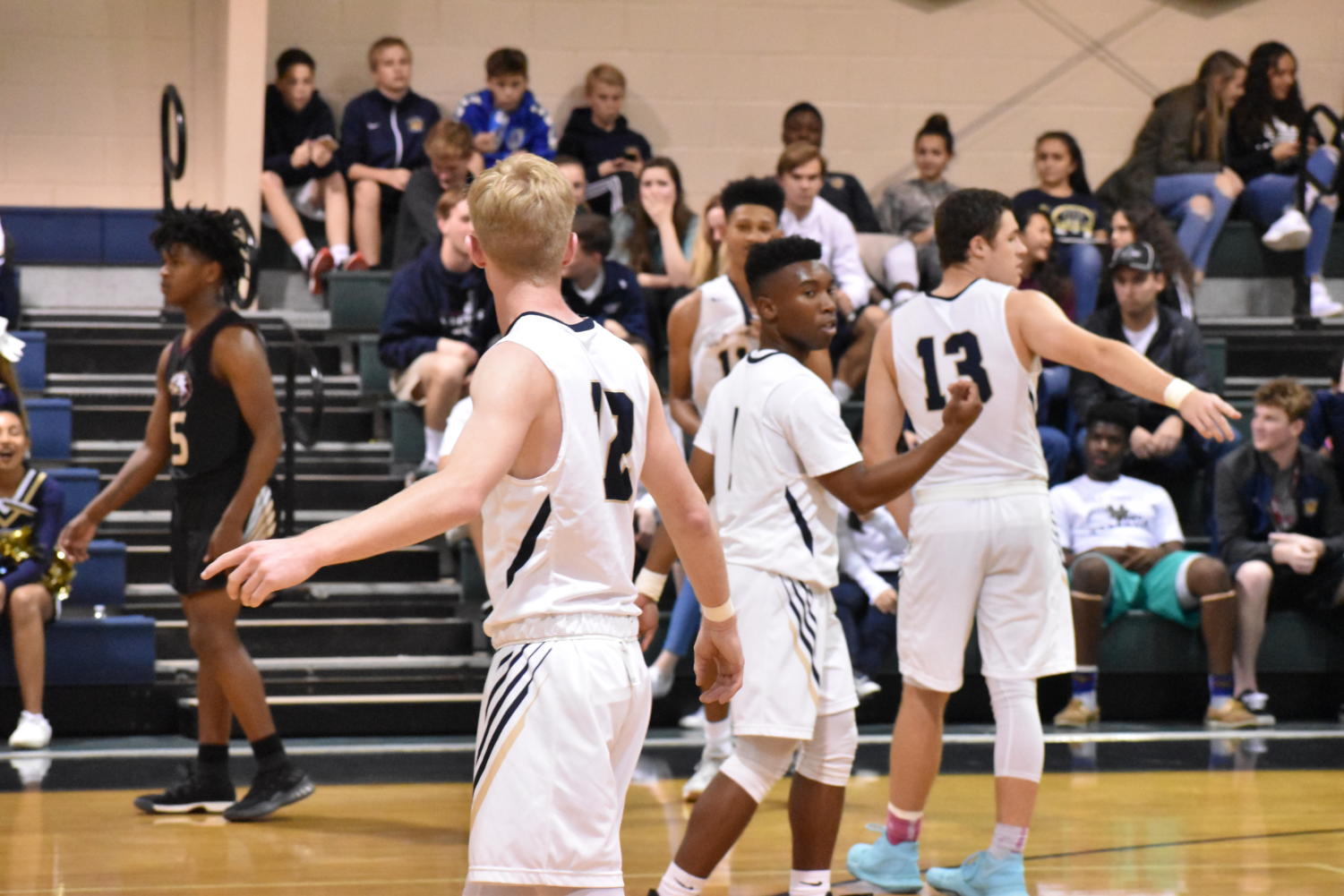 Seniors Zach Pfeil, Jaden Smith, and Brandon Schwab work together to earn a win on their senior night.