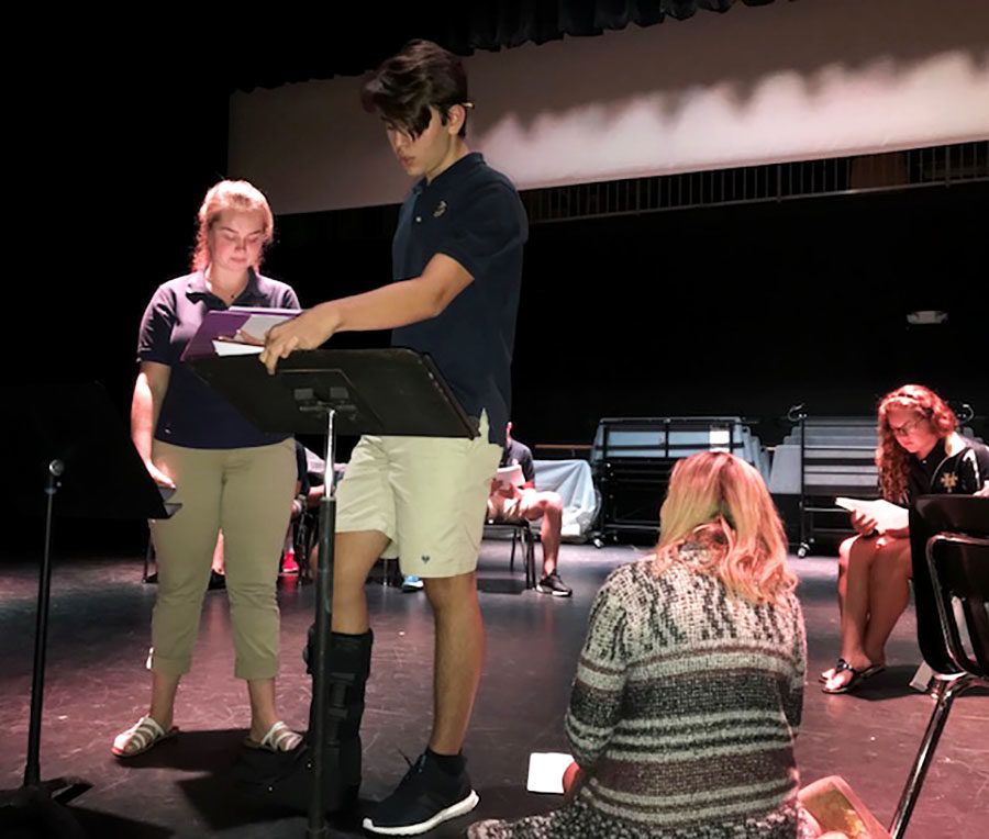 Students Chelsea Terry and Logan Mays rehearse for the fall show, guided  by drama teacher Ms. Meyer.