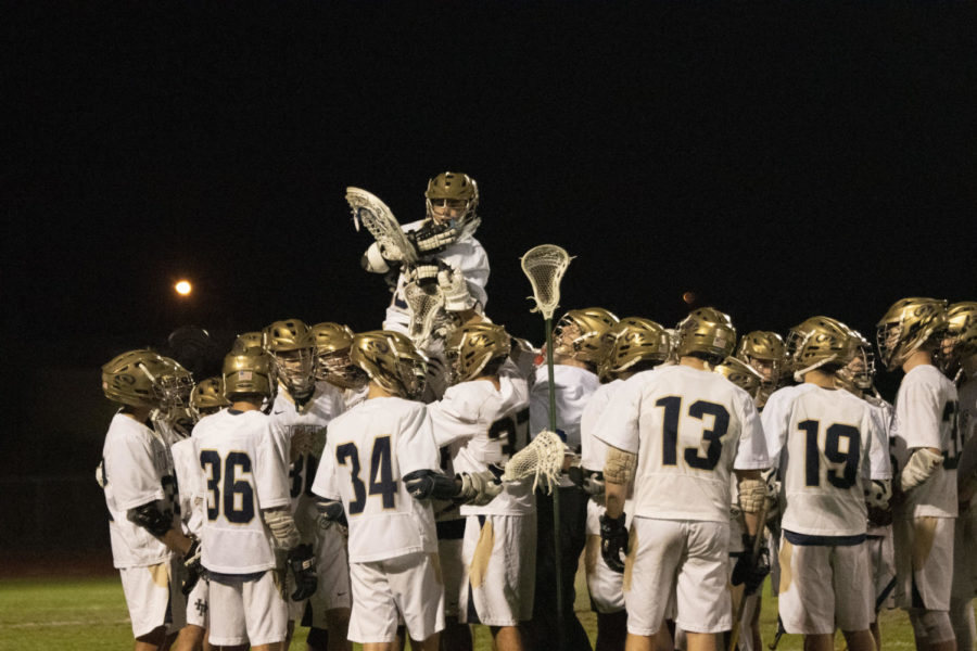 Holy Trinity Lacrosse celebrating after their first season win.