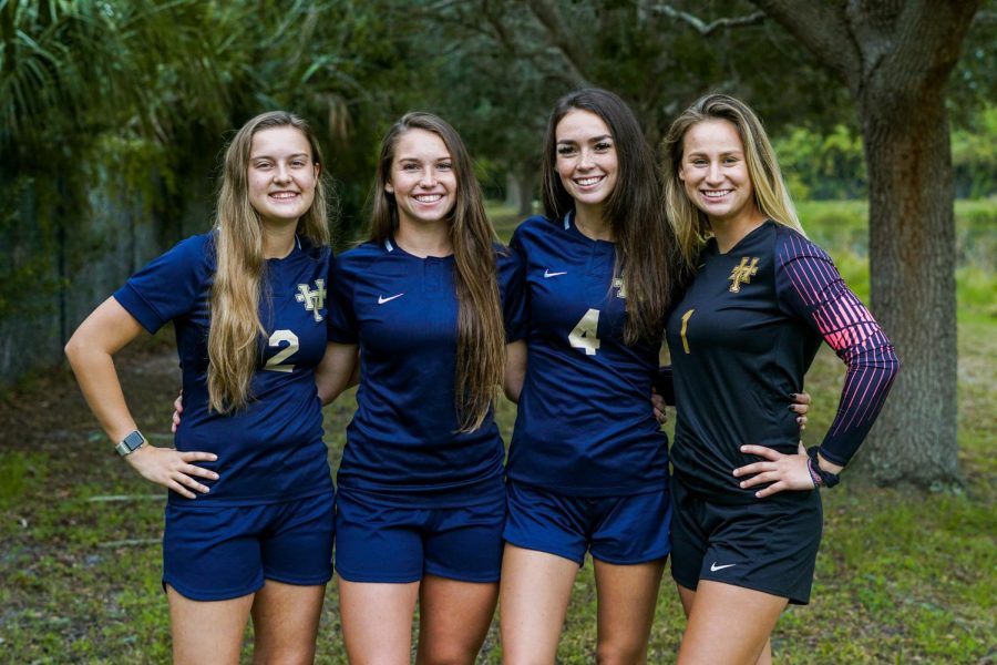 Girls soccer seniors (from left) Amelia Anello, Kailey Dunne, Julia McCarthy, and Payton Yates celebrated Senior Night this past Friday. The group hopes to lead the team on a lengthy postseason run in the coming weeks. 