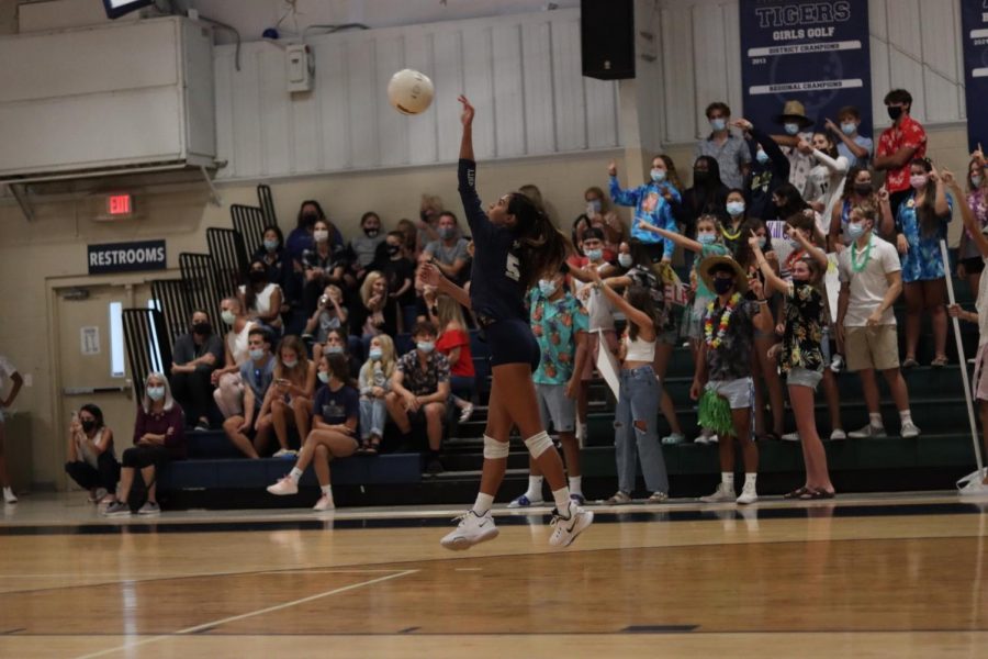 Maya Collins serves the ball during the first home game of the season against Viera