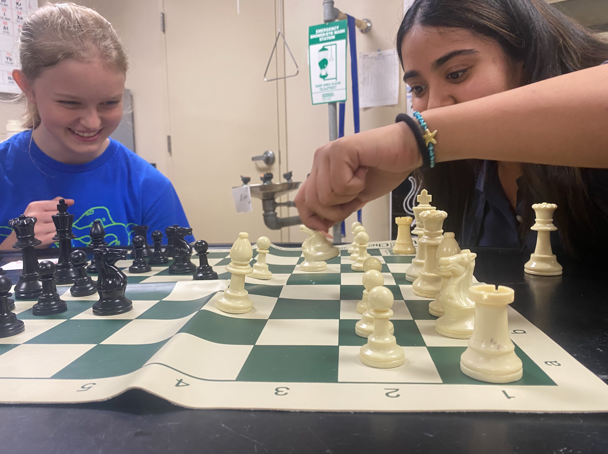 Sophomore Alizeh Irfan passes her pawn in an attempt at checkmating her fellow sophomore competitor, Jules Holleran. 
