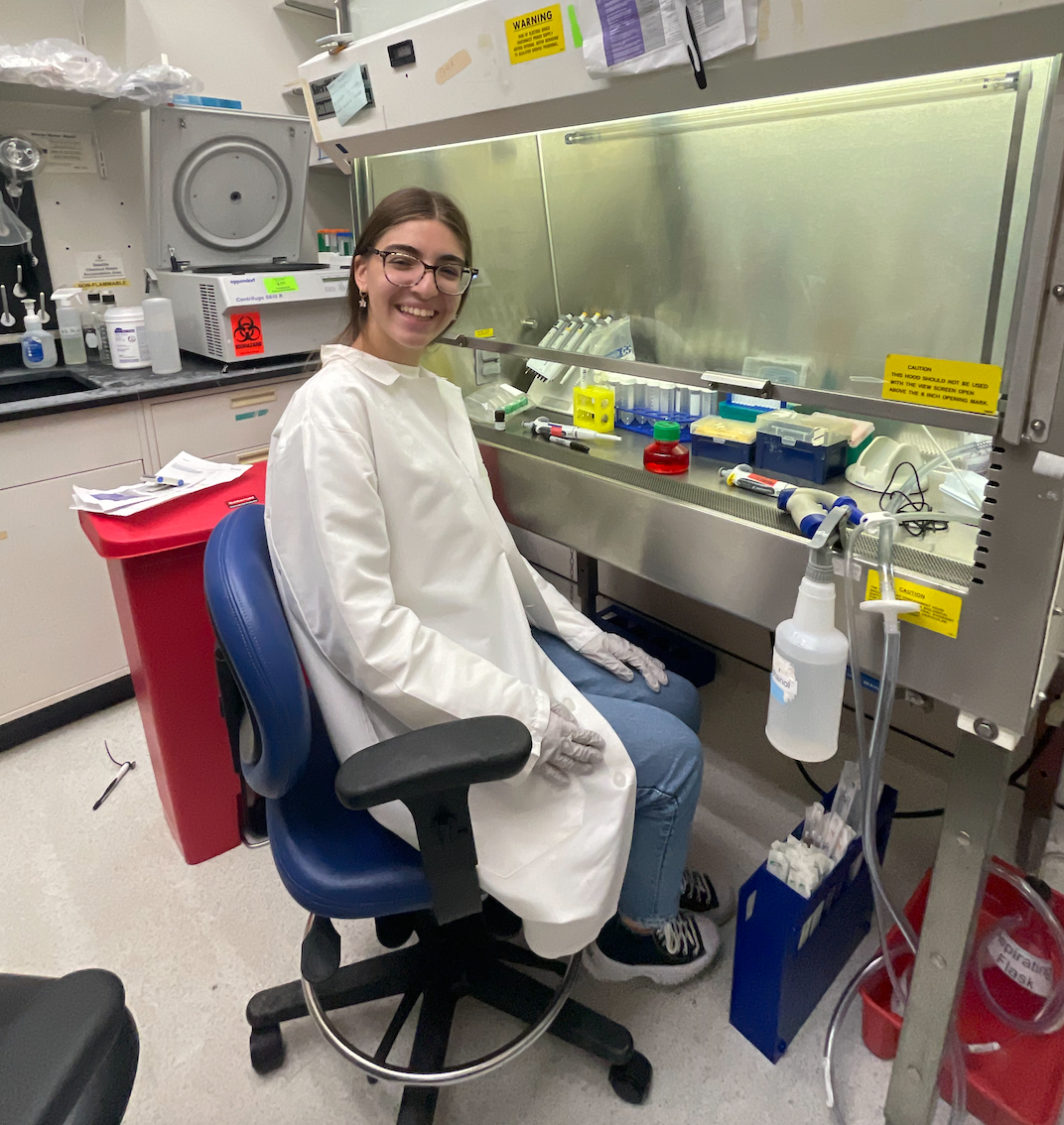 Pictured above, senior Anna Mondschein sits behind the lab bench and takes a break from culturing her cells. Typical lab days are composed of benchwork which includes a daily checkup on cells and testing procedures. 