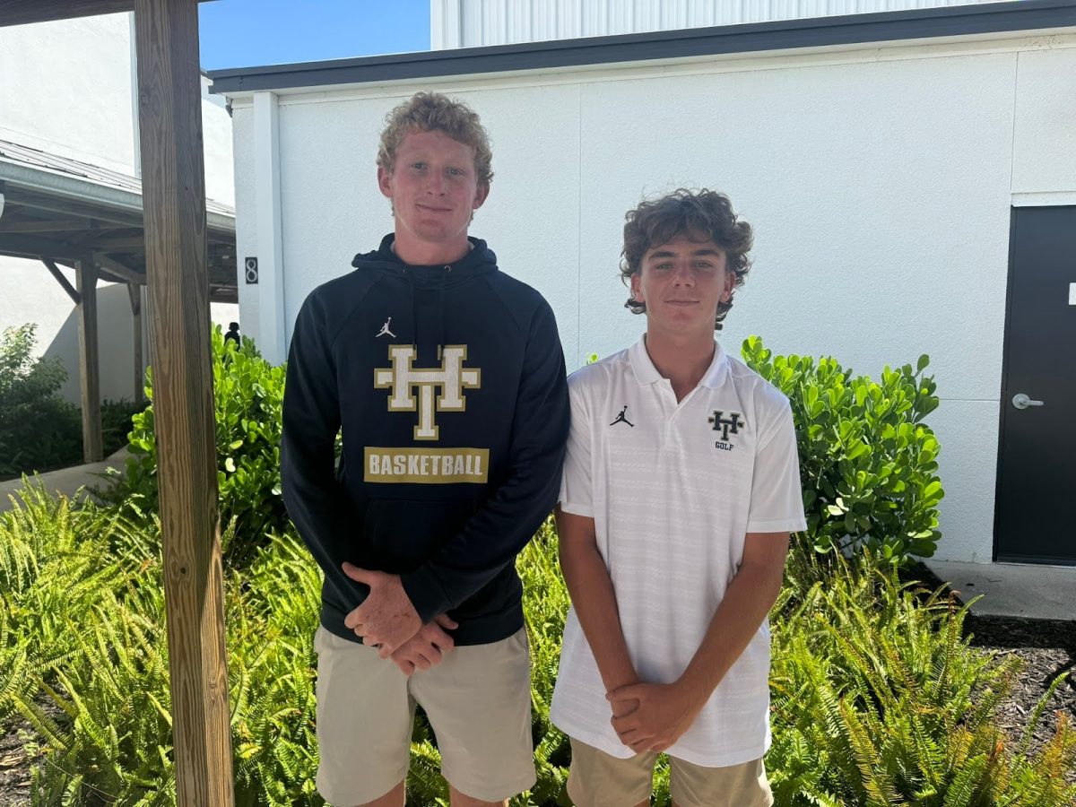 Junior Aiden Holtkamp and sophomore Nate Combs play on Holy Trinity's boys golf team.