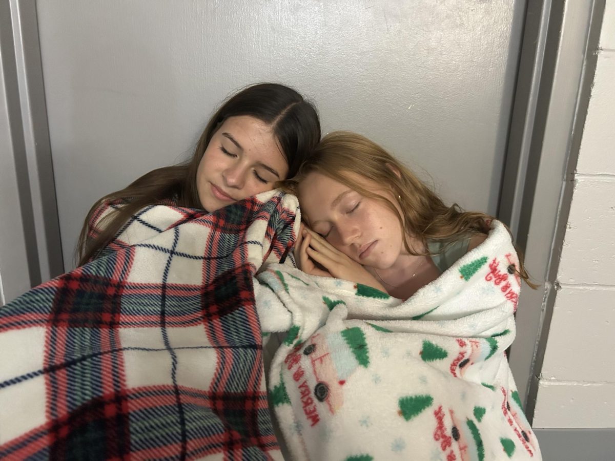 Sophomores Chloe Houston and Emma Buchwald had permission to sleep in class as part of a sleep study in AP Psychology.