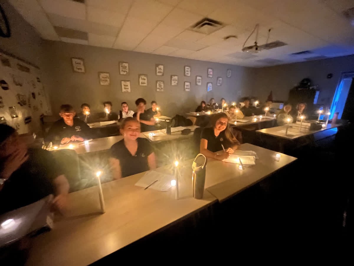 Senior High English teacher Rachel Carroll used battery powered candles to light her classroom during the power outage Tuesday afternoon. Students continued to work on their assignments despite the unexpected loss of power.