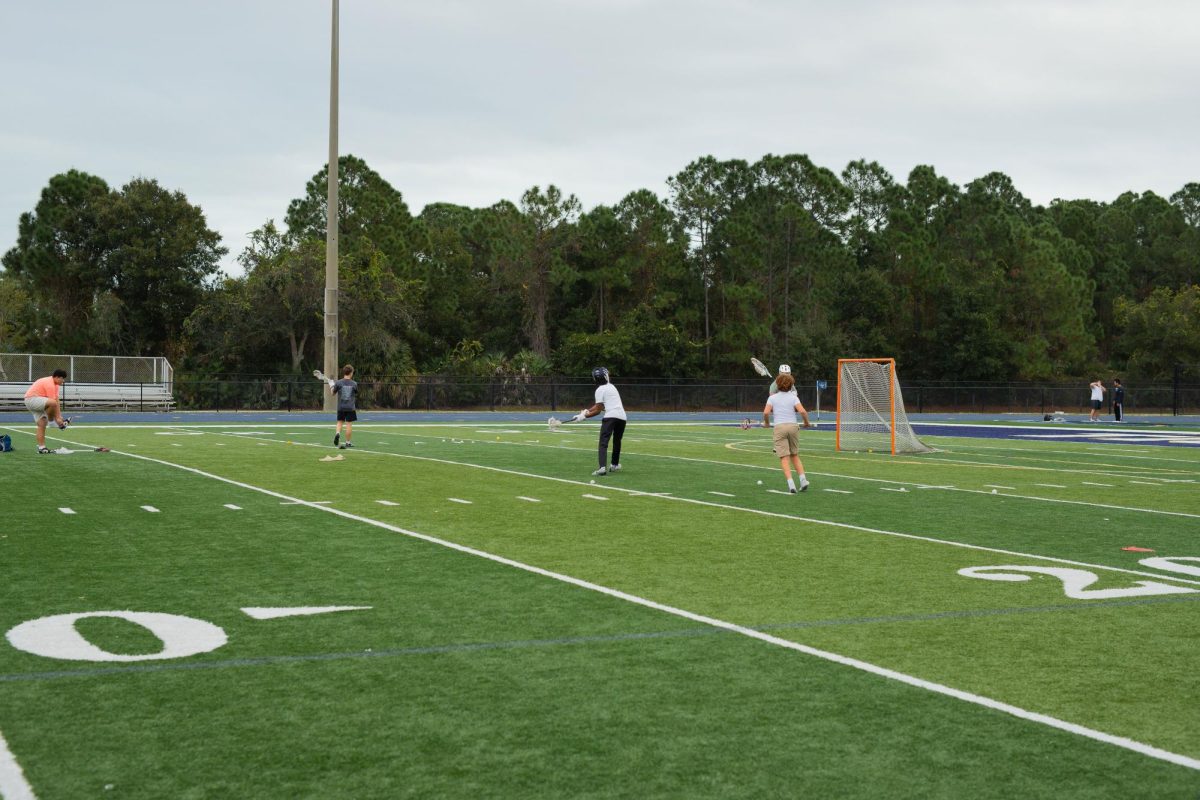 HT Alumni Myles Smith warms up by practicing his shot at Kelly Stadium on December 9, 2025.