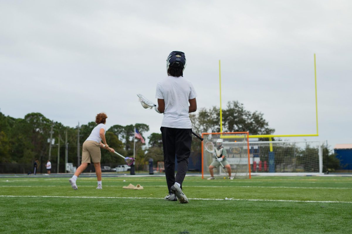 Myles Smith begins his workout by shooting on HT’s goalie Joe Wallace at Kelly Stadium on November 9, 2025.