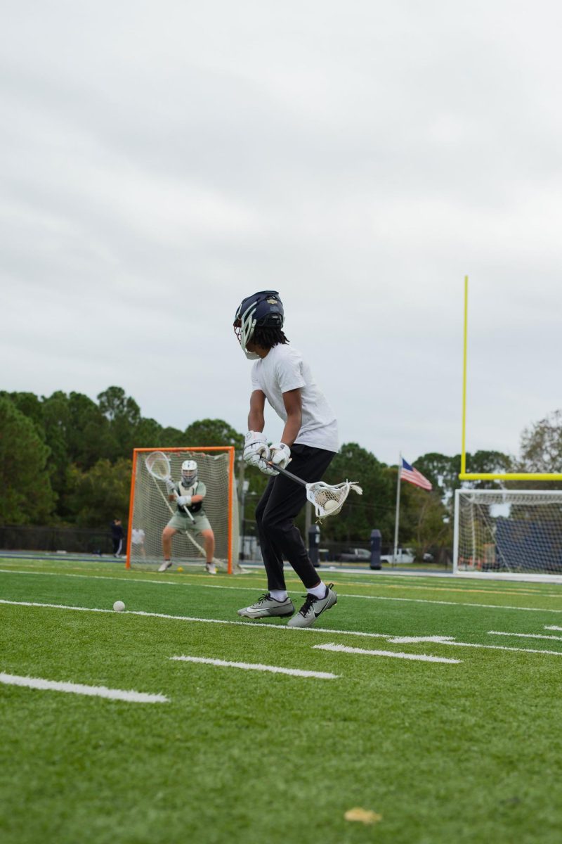Myles Smith goes one on one with goalie Joe Wallace during his workout at Kelly Stadium on December 9, 2025.